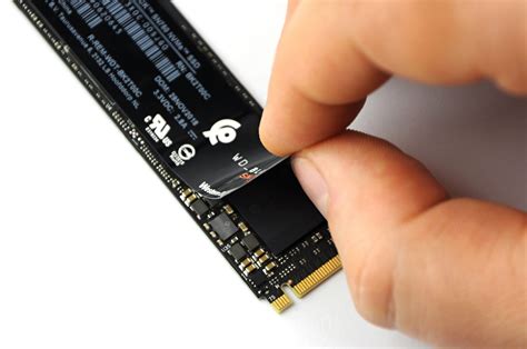 Should you remove an SSD sticker before mounting a heatsink?