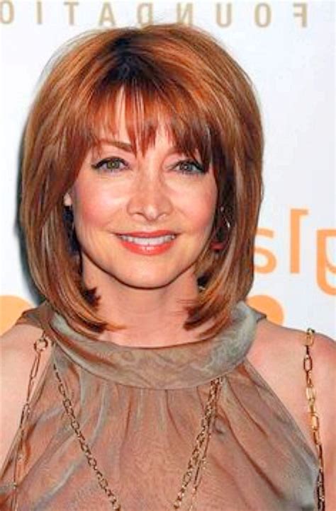 Shoulder length haircuts for older women. A picture-perfect hairstyle for over 50 women with glasses. 6. Copper Curls. Copper curls and waves will have different lengths and shapes if you opt for a long layered haircut for women over 50. Also, get curtain bangs that are curved and longer on the sides. Choose a pair of glasses with a matching frame . 7. 