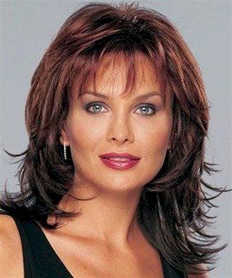 11. Round Face Hairstyle: Source: Latest-Hairstyles.com: The Round Face Hairstyle is a perfect match for over 50 women with round faces. By showcasing long, flowing locks, it adds length to your face, creating an elongated appearance. This style works wonders in balancing proportions and highlighting your features.. 