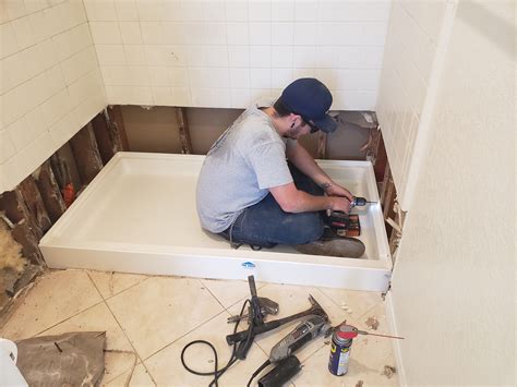 Shower Pan Installation & Replacement · First, we tear everything down to the studs to ensure the underlying structure is safe and not rotted. · We preslope the&n.... 