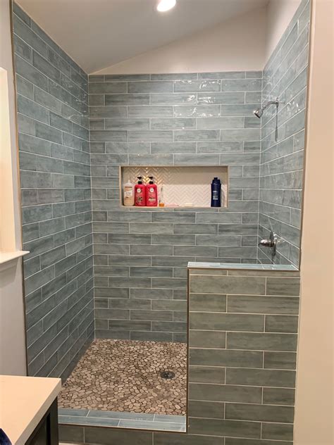 Shower renovations. Mid cost: For a larger investment, perhaps £1,000-£2,000, a new shower enclosure, shower head and perhaps a section of statement tile would be within reach. High cost: A complete remodel of tiles, santiarywear and brasswear will naturally make the biggest difference but be prepared to spend at least £2,000, if not upwards of £3,000. 