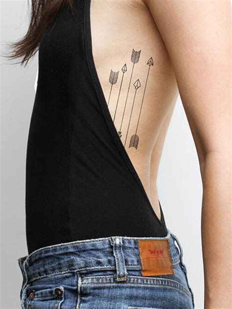 Side rib tattoos female. Among the many inspirations for the female tribal tattoo, this idea brings a tattoo that occupies part of the back and shoulder. In the representation, the tribal design appears in the background with outline and filling in black … 