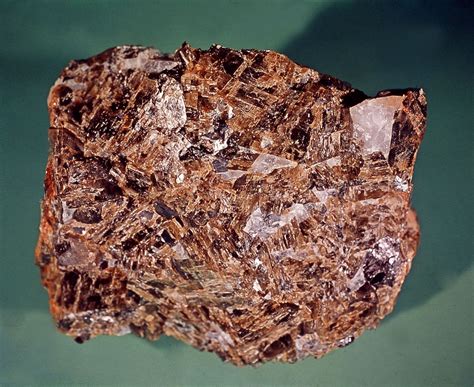 Sideritic. Siderite Physical Properties. The color of siderite varies from yellow, brown, red, green, and gray. It belongs to the calcite group and is a form of carbonate. On the Mohs scale of hardness, siderite is at 3.5 to 4.5. Its chemical composition is FeCO3. Siderite has silky to pearly and opaque to transparent luster. 