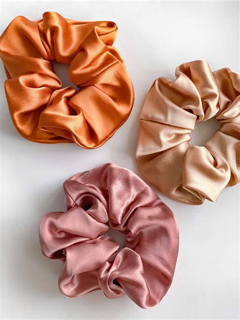 Silk scrunchies. Silk is 100% natural and eco-friendly. It is naturally hypoallergenic, so it is perfect for allergy sufferers. Our silk hair scrunchies are one size fits all. These scrunchies are perfect for ponytail, bun or topknot styles. Choose from these options: 1 White – 1 Blush / White – 2 pcs. / Blush- 2pcs. 