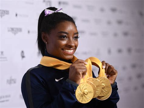 Simone Biles wins another world championships gold medal as US women’s gymnastics team takes seventh successive title