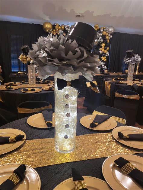 DETAILS: Each Centerpiece has Black, gold and Silver Grad Cap Icons on wire Stems; gold base; black bow; metallic USE: Centerpieces to decorate for a Graduation Party! CELEBRATE LIFE WITH US: Since 1900 The Beistle Company's mission has remained the same: to help people around the world celebrate life's events by creating fun, high quality ....