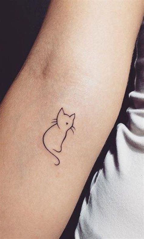Simple cat tattoos. How many people in the world can say they got their newest tattoo done in international waters? When I found out there was going to be a tattoo parlor on board the Scarlet Lady, Vi... 