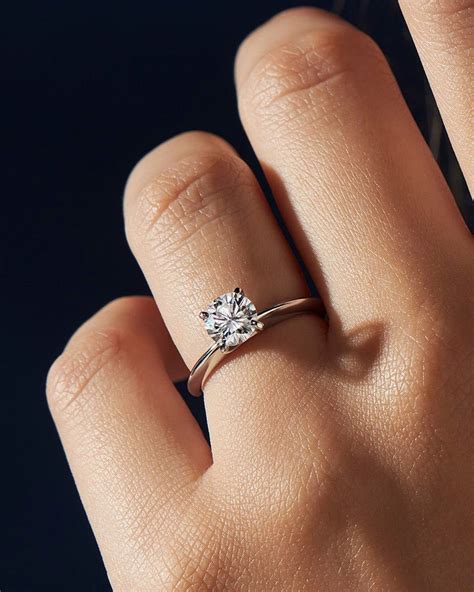 Simple engagement ring. Minimalistic Engagement Rings. Minimalist engagement rings highlight gem cut and shape as the star of your ring. A simple solitaire is a classic that never goes ... 