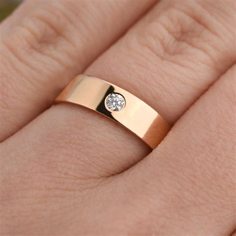 Celebrate your marriage with our curated collection of men’s wedding bands, a diverse assortment of styles that ranges from classic gold bands to eye-catching diamond and gemstone pieces, and alternative metals like forged carbon and tungsten that push the boundaries of design. Our jewelers work to craft each of our wedding rings to the …. 