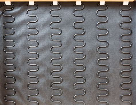 Sinuous spring sofa.  Their wave-like shape allows for easy installation while This compact ch...