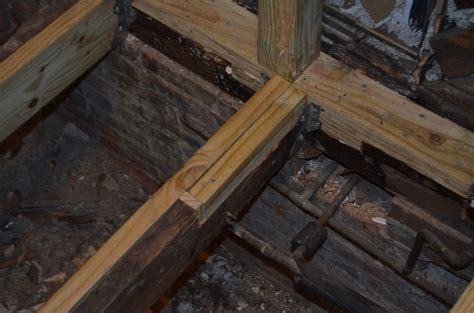 Sistering joists. Using every jack I own and could borrow, I carefully jacked the joist back into level. Then I ripped 5/8″ plywood and glued it onto the webbing to try and stiffen the joist. After that I wedged in a 16′ 2×12 on either side and bolted through the whole “sandwich” with 1/2″ bolts. 