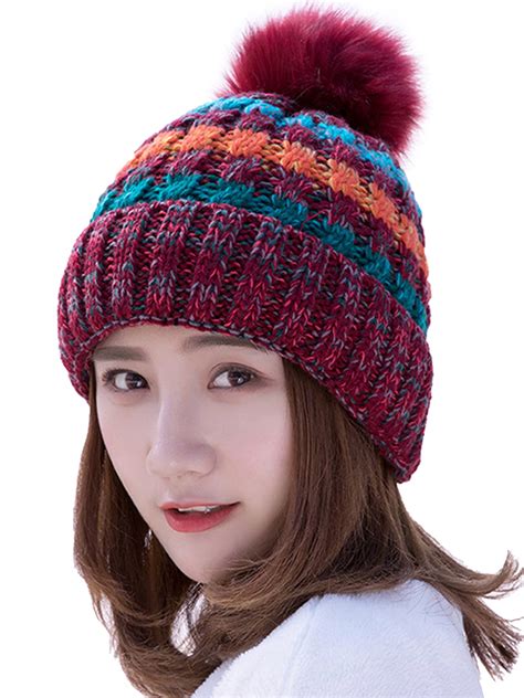 Ski hats with pom poms. .  ...