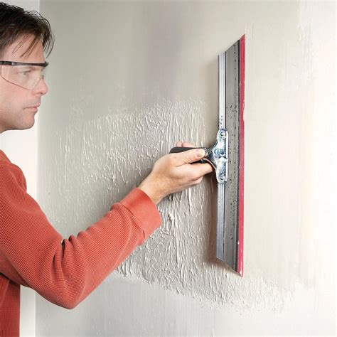 Skim coating walls. To stucco a cinder block wall, apply a concrete bonding agent, apply scratch layer of stucco and then add a finishing coat of stucco, allowing 36 to 48 hours for curing between eac... 