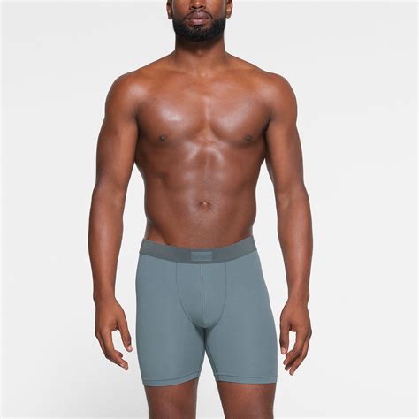 Skims boxer men. Enjoy the look of your boyfriend's boxers with this ribbed option from Kim Kardashian's SKIMS. 5" inseam; 16" leg opening; 10" front rise; 12 1/2" back rise (size Medium) 91% modal, 9% spandex. Machine wash, dry flat. 