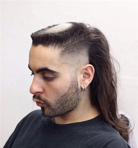 4. Skin Fade Skullet. Opting for a skullet with a skin fade haircut is a less extreme way to try out this controversial hairstyle. While clean-shaved heads draw attention to the contrasts between the back and the front of your head, this option is much more wearable.. 