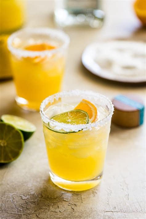 Skinny margarita recipe. Pour a small pile of kosher salt onto a plate. Use a lime wedge to trace the rims of two margarita glasses, then dip the rims into the salt. Set the glasses aside for now. Fill a cocktail shaker as full as possible with ice. Add tequila, lime juice, orange juice, and agave nectar.**. 