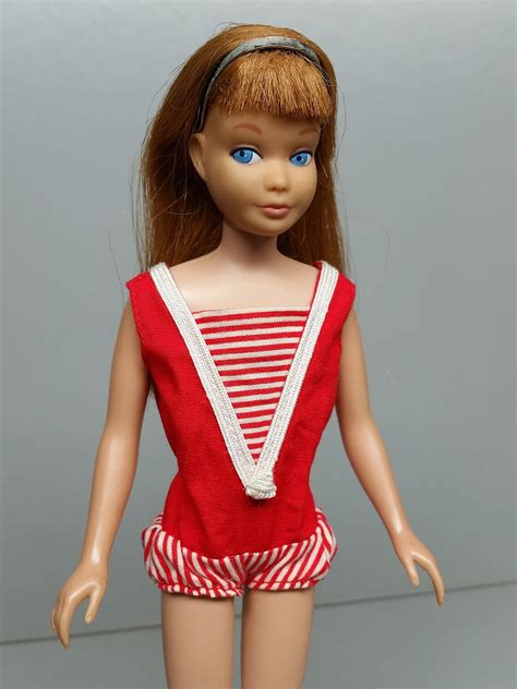 Barbie was a fashion plate, whose closet could be filled with no less than 22 different outfits in her debut year (1959) alone. Skipper was the shorter kid sister, a pretty doll with chubbier cheeks, whose straight, banged hair came in blonde, brunette, and redhead. The first Skippers were sold in boxes labeled “Barbie’s Little Sister.”.