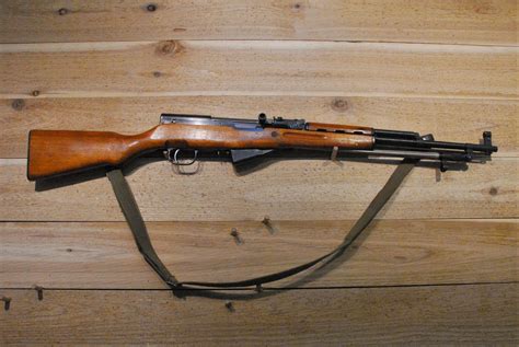 Model: Type 56 Carbine, SKS. Serial Number: 1406381. Year of Manufacture: Modern. There is no reliable way to date Chinese SKS Rifles, with the exception of Arsenal 26 SKS Rifles. Caliber: 7.62x39mm. Action Type: Semi Auto, Fixed Magazine. Markings: The import mark on the left side of the receiver reads "NORINCO SKS 7.62X39 CHINA / KSI POMONA .... 