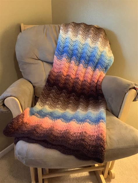 Moonlit Sky Crochet Afghan Kit features a ripple design in relaxing modern colors. Kit includes Herrschners Worsted 8 Yarn, zip storage bag, and instructions. Yarn information: Features a 100% acrylic #4 medium weight yarn. Difficulty: Easy crochet. Finished size measures 40 × 65" (102 x 165cm).. 