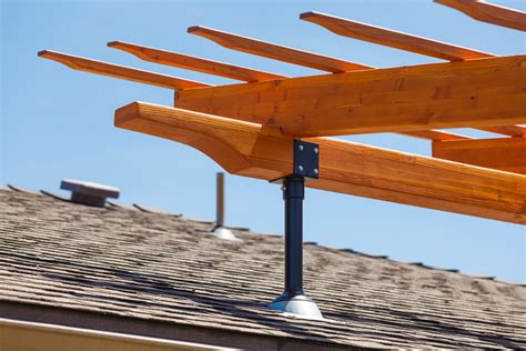 SkyLift Roof Risers are a heavy duty tie-in for new and existing pergolas. The roof risers attach to the exterior wall top plate through the roof to keep your pergola from resting on your shingles. The heavy duty design is built to withstand wind and snow loads while creating an enjoyable patio environment. The roof risers give your pergola the ... . 
