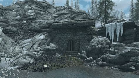 Skyrim gallows hall. I was their sometime ago. It was across a small pond I earned a staff. the one that starts with the W. in the bottom (of the Cave) was a pile of bones. I needed 4 items to make something work. Thanks 