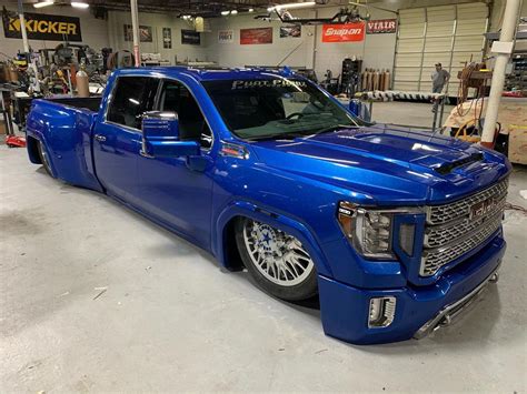 Slammed dually. Lottsa money in this truck! 87 Chevy dually work truck. Professional bagged suspension By Lowboy Motorsports. 6 link rear, custom a arms to kill the camber and tuck the wheels. steers with one finger. Stops great with the hydroboost. heim joint steering. Converted to a Short bed and swapped to a 74 front clip (I'm a sucker for round headlights). 