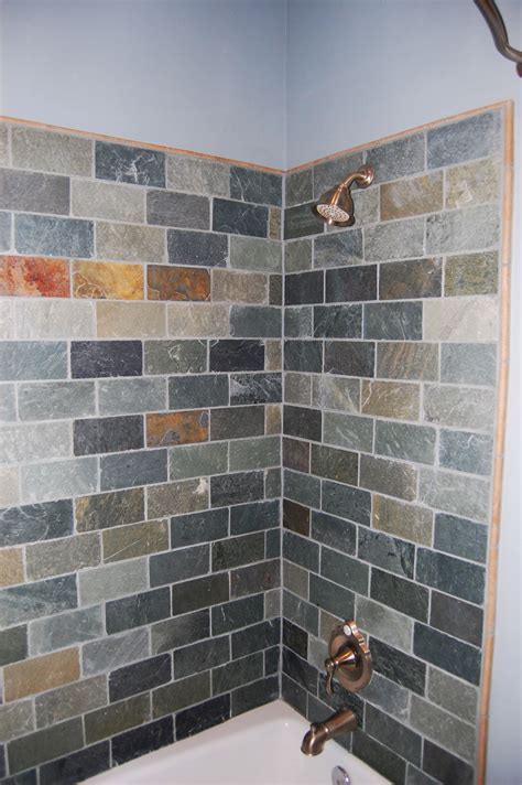 MLB Design Group. Designed by Marie Lail Blackburn, CMKBD. Bathroom - large contemporary master beige tile, brown tile, gray tile, multicolored tile and slate tile bathroom idea in Seattle with granite countertops, raised-panel cabinets, dark wood cabinets, beige walls and an undermount sink. Save Photo.. 