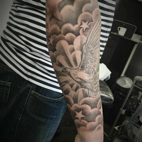 Before going for a half-sleeve wolf tattoo, make sure to find a creative tattoo artist who can make a realistic piece since it’ll have the best results for a sleeve piece while leaving a more significant impact. 18. Clouds Half Sleeve Tattoo. Cloud tattoos represent all kinds of things and can be easily interpreted in many ways.. 
