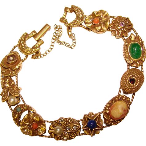 Slide jewelry. Vintage Goldette Slide Charm Bracelet Goldtone Victorian Revival 1960s Bee Cameo. $49.00. $6.50 shipping. or Best Offer. 
