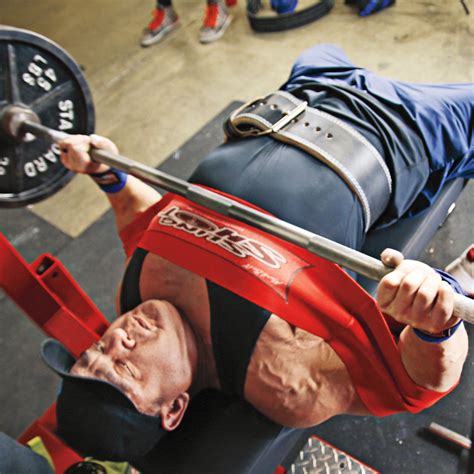 Slingshot bench press. Sling Shot, a nifty little device developed by weightlifting legend Mark Bell ($55, markbellslingshot.com ), allows a person to bench press heavier weight and more often. The difference it makes ... 