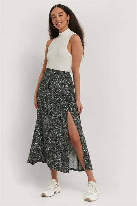 Slit skirt. Black midi skirt. Silver skirts. Silver sequin skirts. Satin midi skirts. Leopard print midi skirt. Black crochet skirt. White stretch skirts. Get party-ready and earn all the style points with this edit of side split skirts, from midi to maxi lengths to floral skirts with splits. Shop split skirts at PLT. 