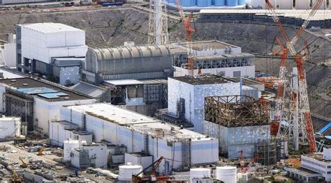 Small areas reopen near Fukushima nuclear plant, few return