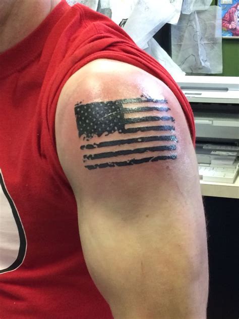 Small patriotic tattoos for guys. Patriotic tattoos have many interpretations for men’s shoulders. One frequent image is the U.S. flag. It has red and white stripes and 50 stars on a blue background on the top left of the flag. The 50 stars on the U.S. flag symbolize the 50 states of the United States. 