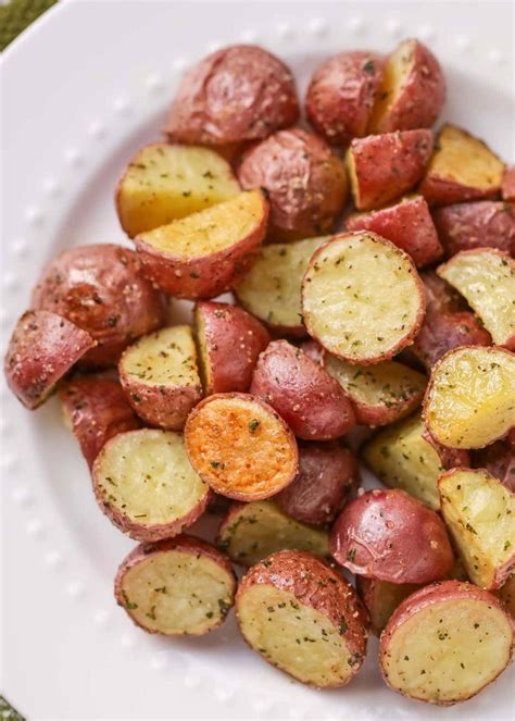 Small red potatoes. Place potatoes into the slow cooker. Stir in olive oil, butter, garlic, oregano, basil and dill, and gently toss to combine; season with salt and pepper, to taste. Cover and cook on low heat for 4-5 hours or high heat for 2-3 hours, or until tender.*. Serve immediately, sprinkled with Parmesan and garnished with parsley, if desired. 
