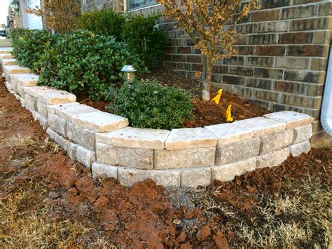 Small retaining wall. For small retaining walls, a depth of 4-6 inches is sufficient for the base material, while taller walls may require a deeper base. Use a plate … 