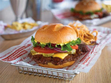 Smashburger. Grilled Onions Adds 45 Calories. Applewood Smoked Bacon Adds 45 Calories. Freshly Smashed Avocado Adds 70 Calories. Fried Egg Adds 110 Calories. Customize: Red Onion: Red Onion. Lettuce: Lettuce. Tomatoes: Tomatoes. Pickles: Pickles. 