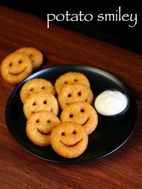 Smiley potatoes. For each potato face, use the rounded edge of a spoon to make the smile and the tip of a straw or chopstick to make the two eyes. Bake the prepared potato smiley face fries on a lined baking sheet in the preheated oven for 10 minutes, flip, and bake for another 10 minutes until golden brown and crisp. 