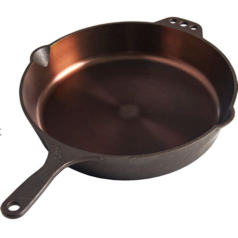Smithey cast iron skillet. To season a cast-iron skillet in the oven, wipe the interior and exterior of the pan with a thin layer of oil and bake it at a high temperature (somewhere between 450 and 500 F) for … 