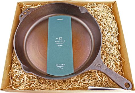 Smithey ironware. Made in the USA by the renowned craftsmen and women of Smithey Ironware Co., the Smithey No. 12 Cast Iron Skillet is designed to be a family heirloom. Perfect for pan-frying, searing, roasting, and even baking, the No. 12 is also at home outdoors over an open campfire. Features pour spouts, an ergonomic handle with a hole for hanging, and a ... 