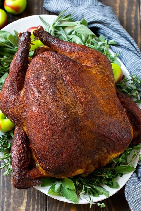 Smoke turkey recipe. When the thermometer reaches between 165 and 180 degrees F, remove the turkey from the smoker and place on a platter. Let the turkey rest for 15 minutes. 8. Carve. Use a carving knife or any large, sharp, unserrated knife to carve the turkey. Don't be alarmed by pink meat — this is normal for a smoked turkey. 