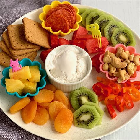 Snacks for kids. Spring: Enjoy the arrival of the first fruits of the year: strawberries and apricots are the heralds of spring. 2. Ants on a Log. Ants on a log are a classic cheap snack of celery spread with nut or seed butter and dotted with craisins or raisins. Kids love them! 