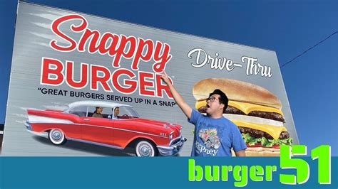 Snappy burger. Vehicles order at Snappy Burger drive-thru hamburger stand and drive-in movie theater below a screen preparing to show the movie "Groundhog Day" during a Groundhog Day celebration in Las Vegas,... 