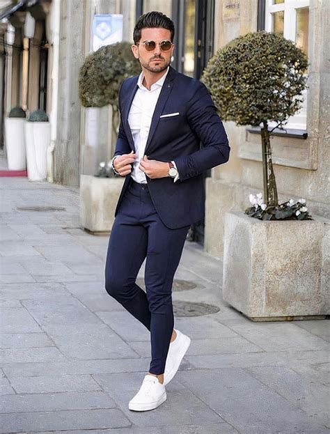 Sneakers to wear with suits. You can wear brown dress shoes or casual shoes like bucks or loafers. -Gray: Gray is another versatile neutral color that goes well with black. It’s a good choice for job interviews and other formal occasions. -Blue: Blue is a great color to wear with a black suit because it creates contrast without being too harsh. 