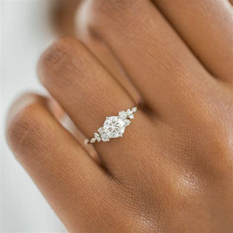 Snowdrift ring. This version of jewelry designer Melanie Casey's bestselling Snowdrift Ring design features a flurry of ten diamond accents that sparkle along a delicate gol... 