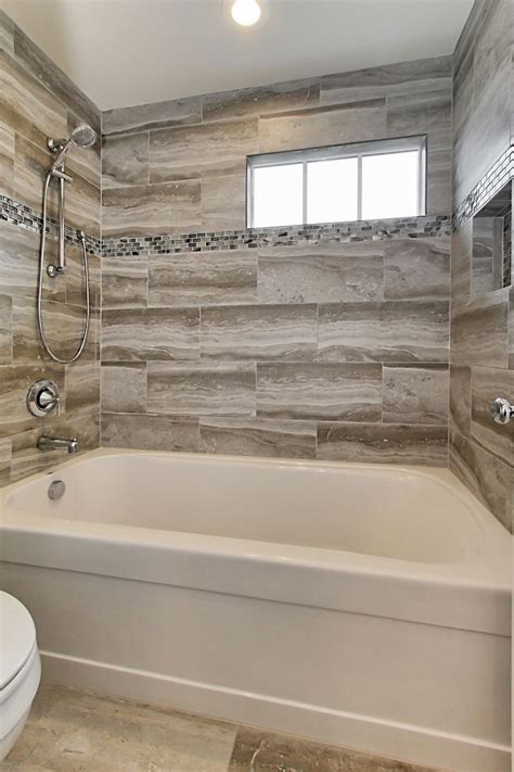 Soaking tub and shower combo. Inspiration for a mid-sized modern 3/4 tub/shower combo remodel in Austin with white walls, a two-piece toilet and a pedestal sink. ... A new 72 inch three-wall alcove tub with subway tile and a playfull blue penny tile make create the spacous and bright bath/shower enclosure. The custom made-to-order shower curtain is a fun alternative to a ... 
