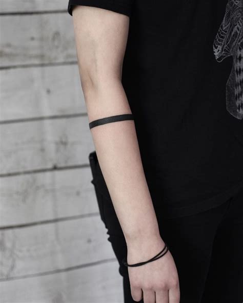 Feb 19, 2017 · A solid black armband tattoo is used