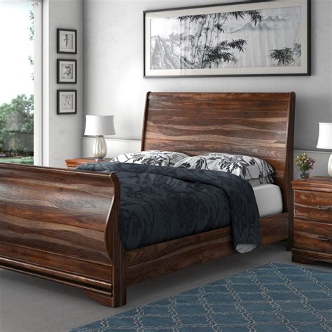 Solid wood bed frames. Description. This platform bed features a sleek, modern silhouette with mixed materials to give your bedroom a blend of rustic and industrial styles. It has an iron frame that's finished in a black hue. The open slat headboard showcases a singular engineered wood panel in a rich brown tone. With 12" of clearance beneath the bed, there's plenty ... 
