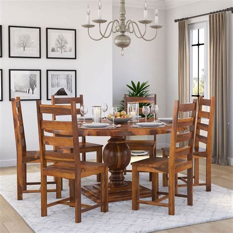 Solid wood dining set. Description. Set a classic foundation in your entertainment ensemble with this five-piece dining set, perfect for a smaller dining space. Crafted from solid rubberwood, this set includes one round table with a pedestal base and four matching chairs. Though the open X-shaped design of the chair backs gives this set a traditional look, a neutral ... 