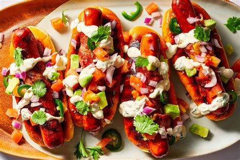 Sonoran hot dogs. The Sonoran Hot Dog is a Southwestern favorite. This bacon-wrapped hot dog is topped with beans, onions, tomatoes, cheese, and all your favorite condiments. ... 
