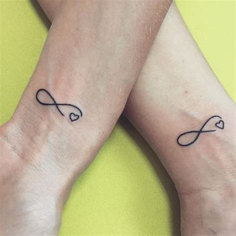 Soulmate infinity couple tattoo. These tribal his and hers tattoo ideas will create an intimate bonding experience for the love birds. Accentuate the tribal tattoos with sun and moon, the famous four-leaf clover, double foxes, or some very abstract colorful designs. Create an original design and find a unique tattoo choice to display the wild side. 